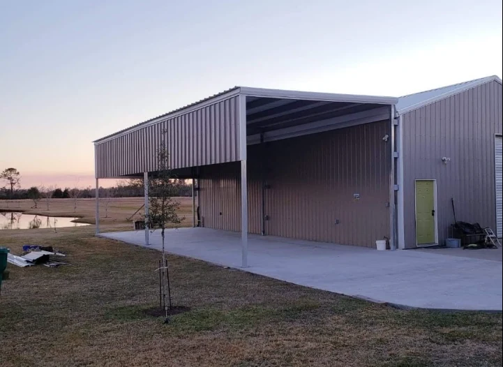 Metal building with covered concrete area
