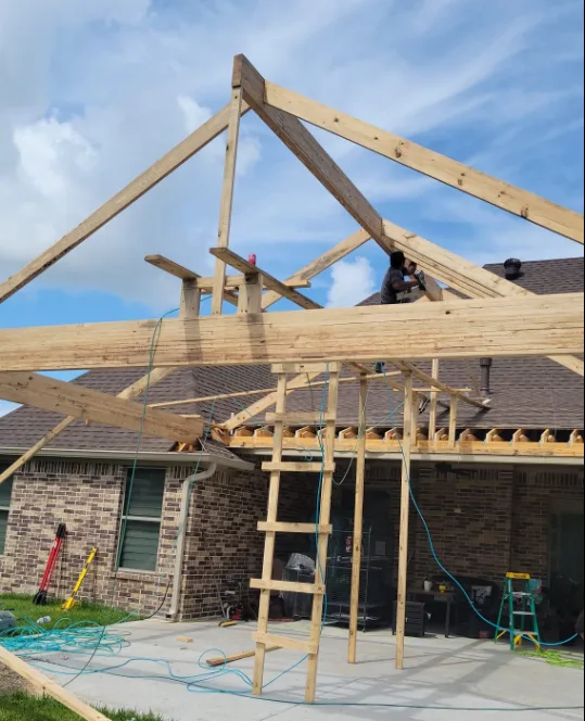Wood framing under construction for a covered outdoor structure